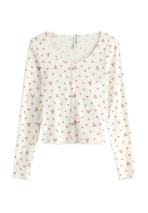 Cardigan bianco a maniche lunghe con motivo a coste strutturato, caratterizzato da piccole stampe floreali rosa, scollo tondo e bottoni sul davanti.