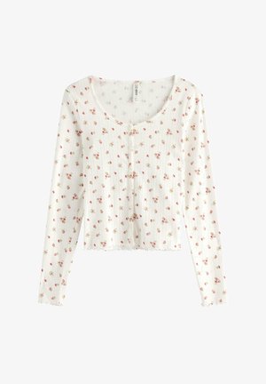 Cardigan bianco a maniche lunghe con motivo a coste strutturato, caratterizzato da piccole stampe floreali rosa, scollo tondo e bottoni sul davanti.