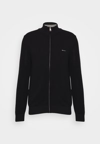 Schwarze Zip-Up-Strickjacke aus strukturiertem Strickstoff. Sie verfügt über einen hohen Kragen und ein kontrastierendes gestreiftes Innenfutter. Kleines Logo auf der linken Brust.