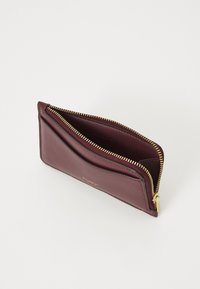 Burgundy leather wallet with gold-tone zipper, features an open compartment and a flat pocket on one side for cards or notes.