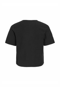 Svart t-shirt med kort ärm, rund halsringning och boxig passform. Slät bomullstyg, med sidsprund i nederkant för ökad komfort.