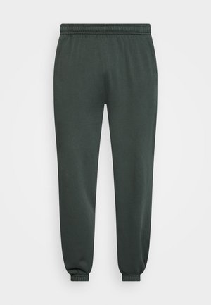 Pantalon de survêtement gris foncé, longueur cheville, avec taille et poignets élastiques, présenté à plat sur un fond clair.