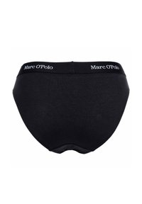 Zwart katoenen ondergoed met een gladde textuur. Beschikt over een brede tailleband met het "Marc O'Polo" logo in het wit. Klassieke slipvorm.