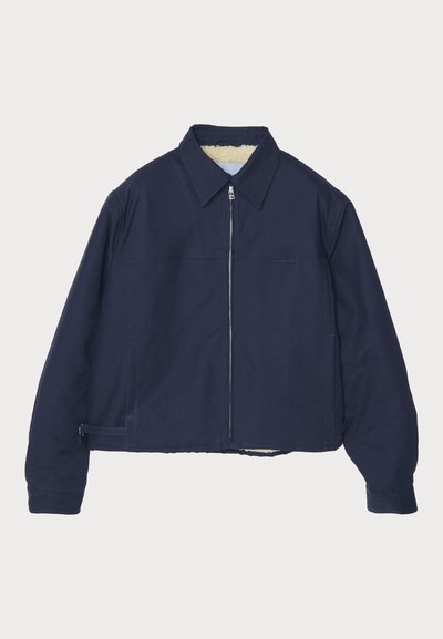 Navy blue jacket with a zip front, pointed collar, and lined interior. Features a cropped design and side zipper pockets.