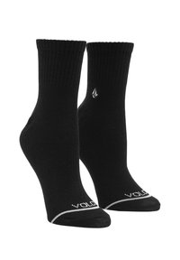 Calcetines de tobillo de mezcla de algodón negros con puño acanalado, talón reforzado y detalle de logo blanco en la zona del dedo del pie y el tobillo.