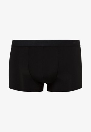 Zwarte boxershorts van een gladde stof, met een zachte elastische tailleband waarop de merknaam subtiel is geperst. Naadloos ontwerp en een nauwsluitende pasvorm.