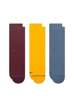 Set of three socks: burgundy, yellow, and blue. Made from knitted fabric with a smooth texture and contrasting turquoise accents near the toes.
