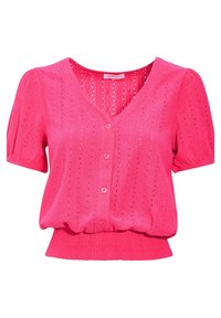 Blouse rose à manches courtes avec décolleté en V, en tissu texturé, fermeture à boutons et ourlet froncé. Dispose de détails en œillets pour la ventilation.