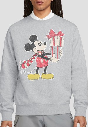 Gray sweatshirt featuring a large graphic of Mickey Mouse holding two presents, with a red and white striped scarf and yellow shoes.