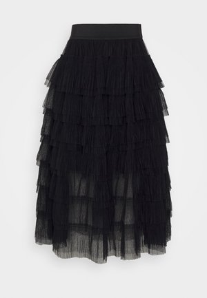 Jupe en tulle noir avec des volants superposés, taille élastique et texture transparente. Design fluide avec des longueurs de volants variées.