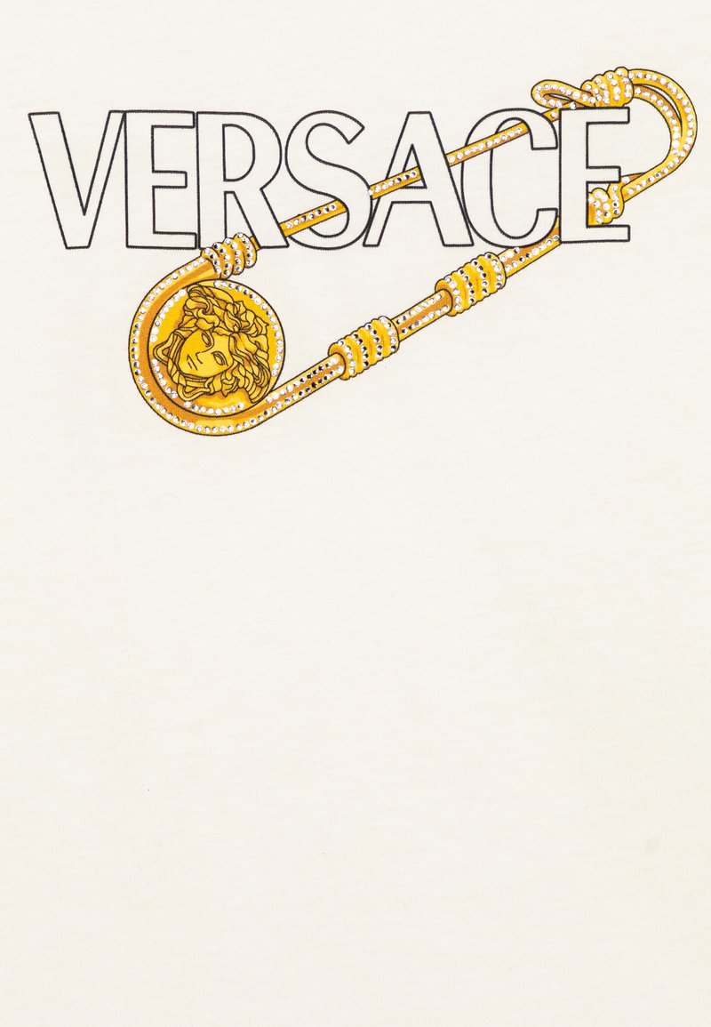 gold versace emblem