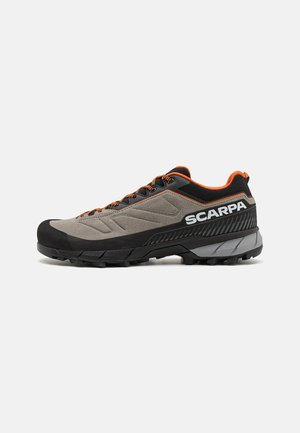 Scarpa hiking shoes featuring a grey and black design, textured rubber toe cap, orange accents, and rugged sole for traction.