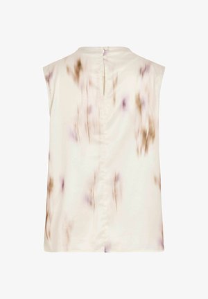 Blouse crème sans manches avec un imprimé floral subtil marron et violet, ouverture au dos en forme de trou de serrure, et deux petits boutons à l’encolure.