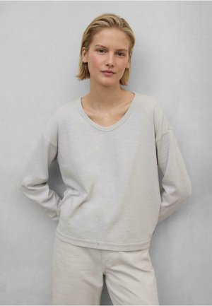 Ljusgrå långärmad sweatshirt med V-ringning, avslappnad passform och sänkta axlar. Mjukt material med en sömdetalj nedtill fram.