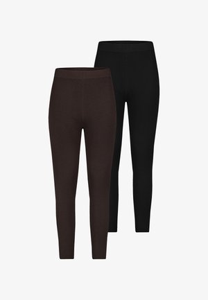 Gerippte Leggings in Dunkelbraun und Schwarz. Verfügen über eine taillierte Silhouette und einen elastischen Bund. Hergestellt aus weichem, dehnbarem Stoff.