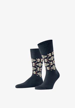 Marineblaue Socken mit einem gemusterten Design in Creme, Rot und Dunkelblau, ausgestattet mit einem gerippten Bund und einer glatten Textur.