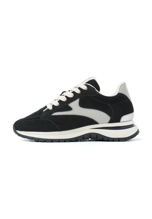 Black and gray suede and mesh sneaker with white laces, cushioned sole, and rugged black rubber outsole.