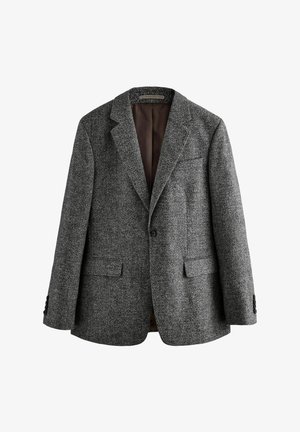 Grijze gebreide blazer met twee voordooi zakken, notch revers en een bruine binnenvoering. Heeft twee knopen op elke manchet.