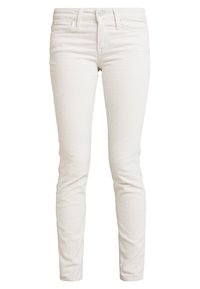 Tajta vita kordflossbyxor med knapp- och dragkedjestängning, fram- och bakfickor samt bältesloopar.