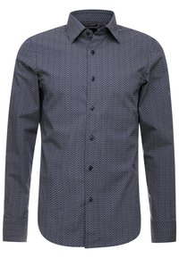 Námořnická košile s knoflíky s vzorem rybího kosti, slim fit designem, dlouhými rukávy a klasickým límcem. Hladká textura s jemným leskem.