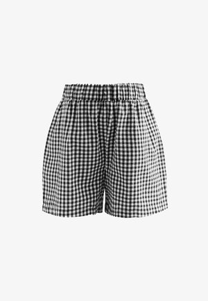 Melnbalts gingham raksts šorti ar elastīgu jostu, kas raksturojas ar brīvu piegriezumu un mīkstu kokvilnas audumu. Redzamu kabatu nav.