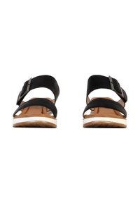 Sandalias de ante negro con dos correas ajustables y punta redondeada. Presenta una plantilla marrón clara y una suela blanca con tracción texturizada.