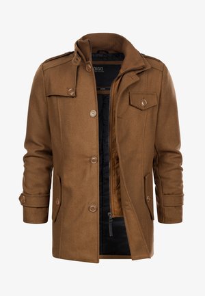 Manteau en mélange de laine marron avec un col montant, des fermetures à boutons et des poches latérales. Intérieur doublé d'un matériau noir. Quatre boutons visibles sur le devant.