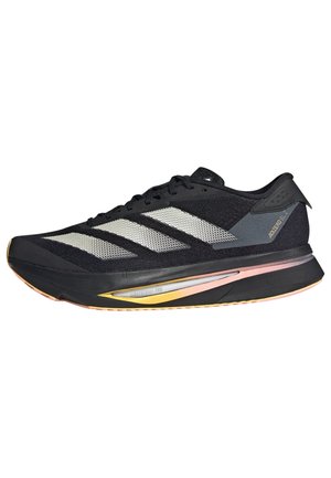 Chaussure de course noire avec des bandes blanches, semelle amortie avec des accents jaunes et roses, et texte "ADIZERO 1.7" sur le talon.