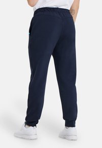 Arena UNISEX - Jogginghose - blau