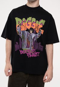 Black oversized t-shirt featuring a graphic of a man in a colorful patterned outfit. Text reads "BIGGIE" and "BROOKLYN'S FINEST" in vibrant colors.