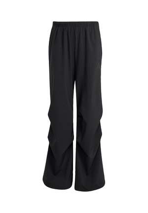 Black athletic pants featuring a wide, loose fit with a layered design, elastic waistband, and minimal branding on the side.