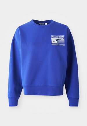 Sudadera azul con cuello redondo y mangas largas. Presenta un gráfico en el pecho delantero con "Monte Carlo" y "Björk Borg Tennis Club".
