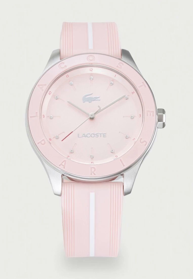 Розов часовник Lacoste със сребрист корпус, кристални маркери за часа и розова каишка с бяла ивица.