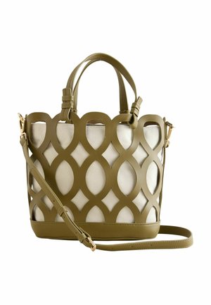 Geantă de mână verde măsliniu cu model decupat circular peste material bej, prevăzută cu două mânere și o curea de umăr reglabilă.