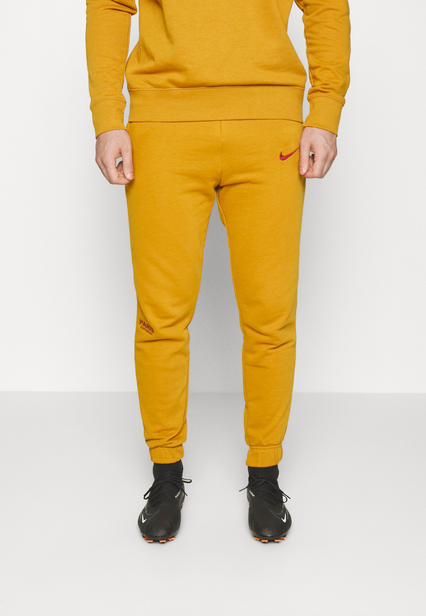nike yellow track pants