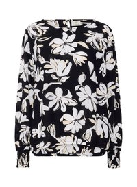 Blouse noire avec motif floral blanc, manches longues avec poignets froncés, encolure ronde et légère transparence du tissu.