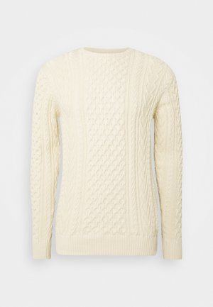 Cable-knit sweater in ivory, featuring a textured pattern with ribbed cuffs and hem. Round neckline and long sleeves.