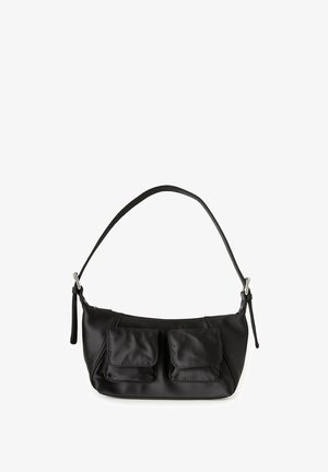 Black nylon shoulder bag with two front flap pockets, an adjustable strap, and sleek design. Features prominent stitching and a smooth texture.