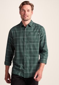 Green plaid button-up shirt with long sleeves, featuring a chest pocket and light gray grid lines on a textured fabric.