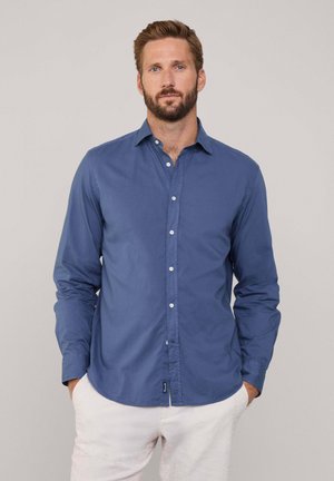 Blaues Langarmhemd mit Knopfkragen, aus glattem Stoff gefertigt. Verfügt über weiße Knopfverschlüsse und einen abgerundeten Saum.