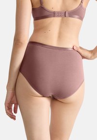 High-waisted brief in muted rose color, made from smooth fabric with a seamless design and soft waistband for comfort.