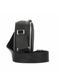 Black shoulder bag with a textured front, smooth materials, zip closure, adjustable strap, and metallic hardware accents. Compact design.