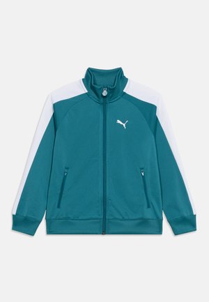 Teal glidelåsjakke med hvite skulderpaneler, ribbet krage og mansjetter, to frontglidelåslommer og en hvit Puma-logo på brystet.