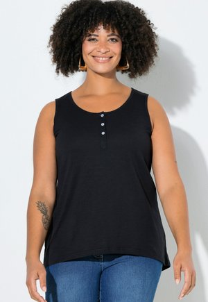 Black sleeveless tank top with a round neckline and button detail at the front. Soft fabric with a relaxed fit, paired with blue jeans.
