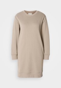 Robe sweat-shirt beige à manches longues avec col rond, poignets et ourlet côtelés, et petit logo brodé sur la poitrine gauche.