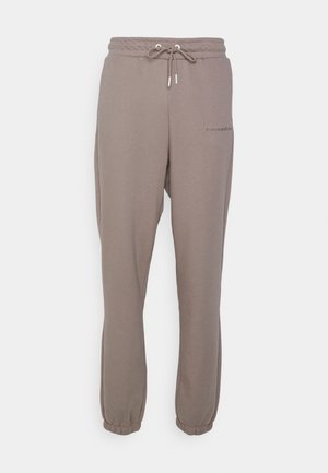 Pantalons de survêtement gris en mélange de coton avec une taille élastique et un cordon de serrage, dotés de poches latérales et de poignets élastiques aux chevilles.