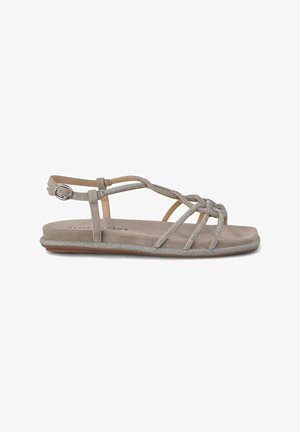 Beige suède sandaal met bandjes, voorzien van metallic accenten en een textuurzed flat sole. Verstelbare enkelband met gesp voor een veilige pasvorm.