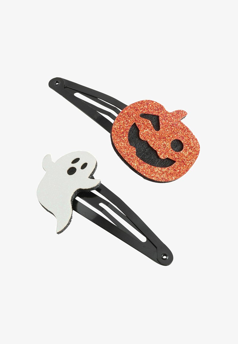 Pinces à cheveux noires avec des décorations scintillantes d'Halloween : un fantôme blanc et une tête de citrouille jack-o'-lantern orange.