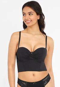 Black undergarment with a structured, padded bra top featuring lace accents and a decorative bow at the center. Thin adjustable straps.