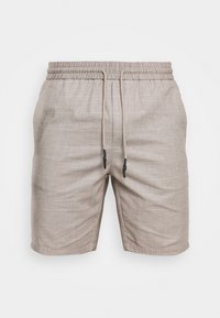 Shorts beige chiaro realizzati in tessuto intrecciato. Presentano un elastico in vita con cordino e un motivo a quadretti discreto. Lunghezza corta, senza tasche.